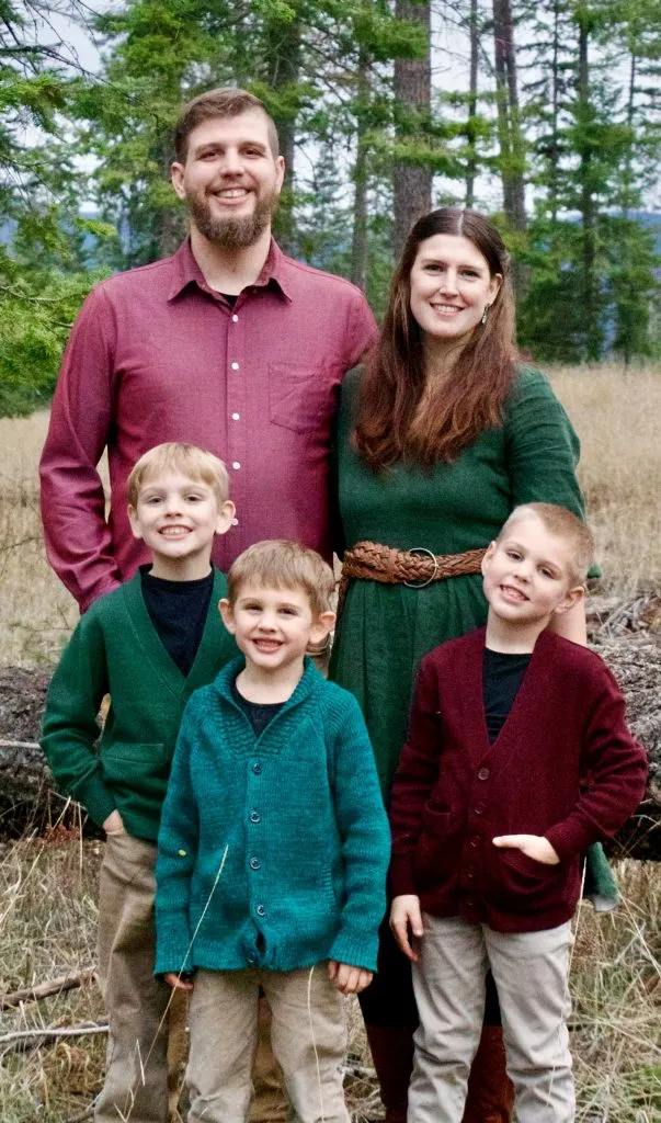 Zachary Griffin with his wife and three sons, standing together outdoors in a North Idaho forest clearing